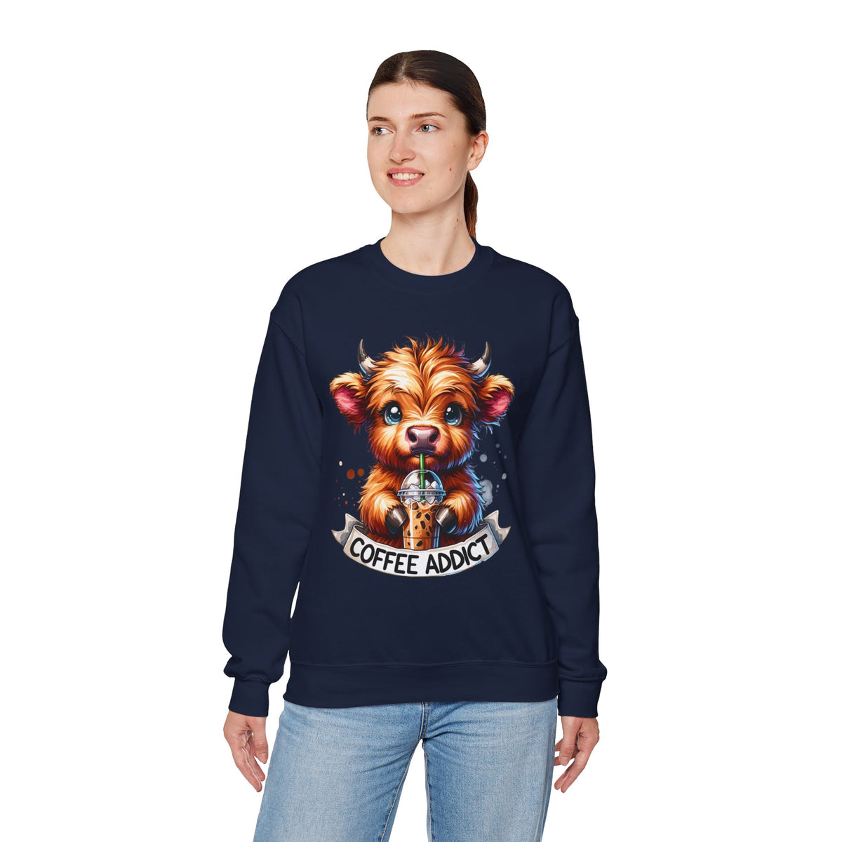 Coffee Addict Highland Cow Drinking Iced Coffee – Gildan Heavy Blend | Trendy Women’s Soft Sweatshirt. Direct to Garment. Printed & Shipped in the USA. Unisex Sizes.