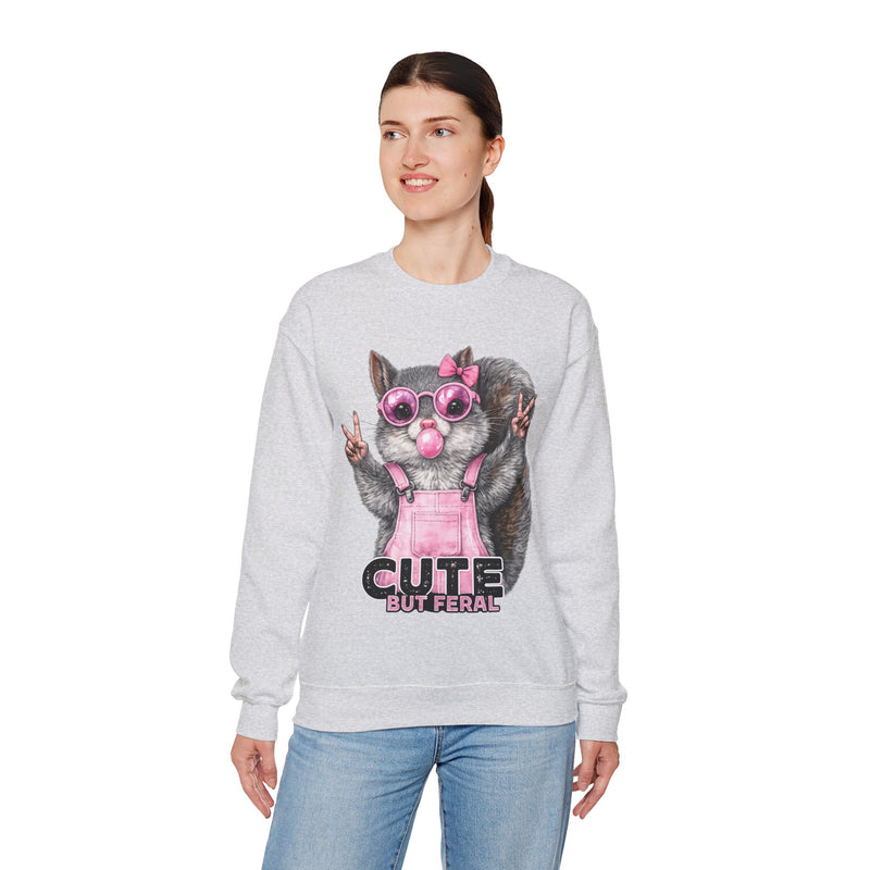 Cute But Feral, Squirrel in Pink Bibs – Gildan Heavy Blend | Trendy Women’s Soft Sweatshirt. Direct to Garment. Printed & Shipped in the USA. Unisex Sizes.