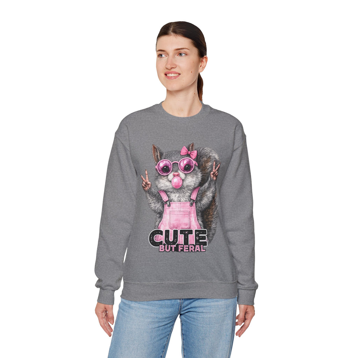 Cute But Feral, Squirrel in Pink Bibs – Gildan Heavy Blend | Trendy Women’s Soft Sweatshirt. Direct to Garment. Printed & Shipped in the USA. Unisex Sizes.