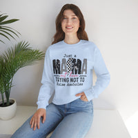 Just a Mama Out Here Trying Not To Raise Assholes – Gildan Heavy Blend | Trendy Women’s Soft Sweatshirt. Direct to Garment. Printed & Shipped in the USA. Unisex Sizes.