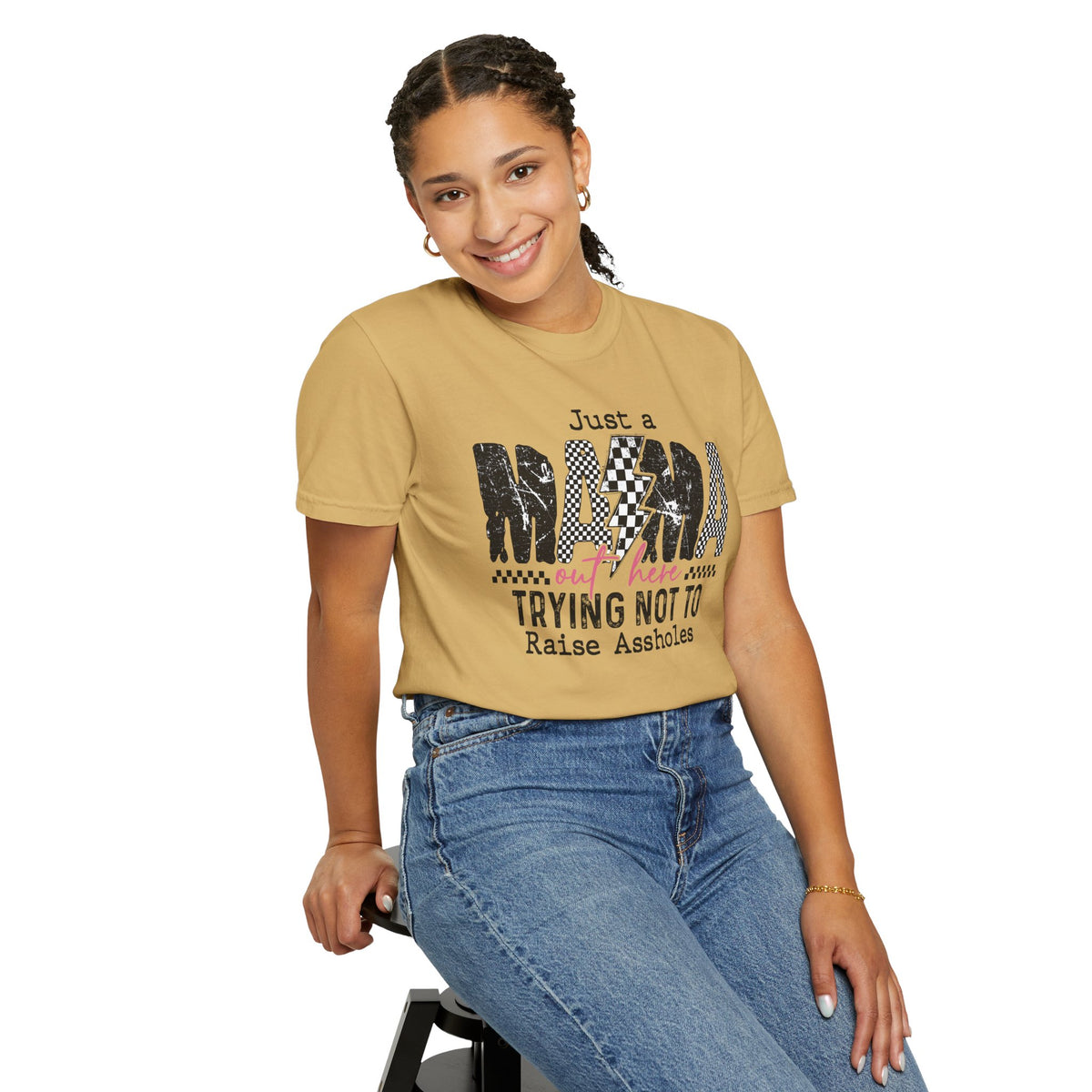 Just a Mama Out Here Trying Not To Raise Assholes - Comfort Colors | Trendy Women's T-Shirt. Direct to Garment. Printed & Shipped in the USA. Unisex Sizes.