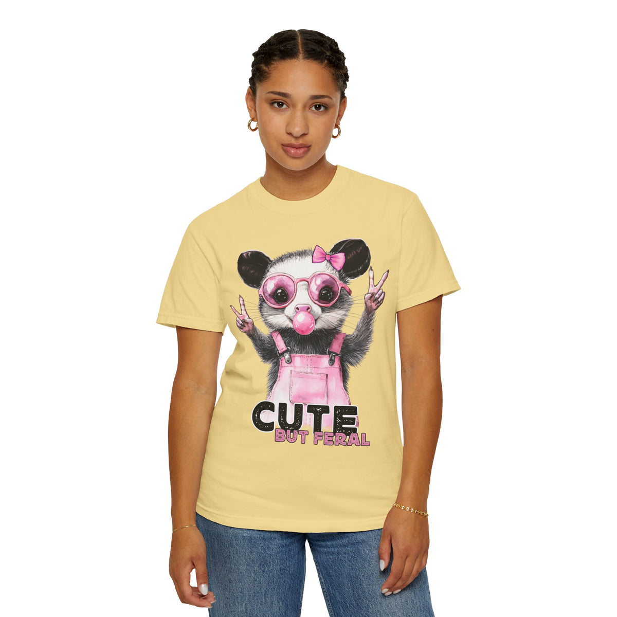 Cute But Feral, Possum in Pink Bibs - Comfort Colors | Trendy Women's T-Shirt. Direct to Garment. Printed & Shipped in the USA. Unisex Sizes.