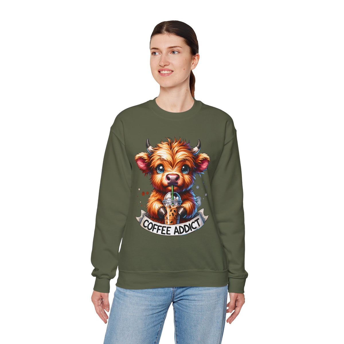 Coffee Addict Highland Cow Drinking Iced Coffee – Gildan Heavy Blend | Trendy Women’s Soft Sweatshirt. Direct to Garment. Printed & Shipped in the USA. Unisex Sizes.