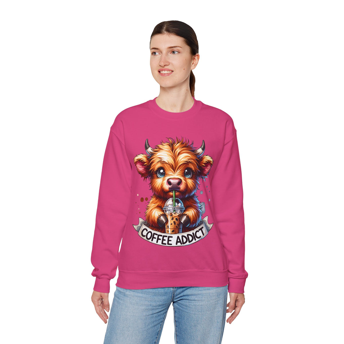 Coffee Addict Highland Cow Drinking Iced Coffee – Gildan Heavy Blend | Trendy Women’s Soft Sweatshirt. Direct to Garment. Printed & Shipped in the USA. Unisex Sizes.