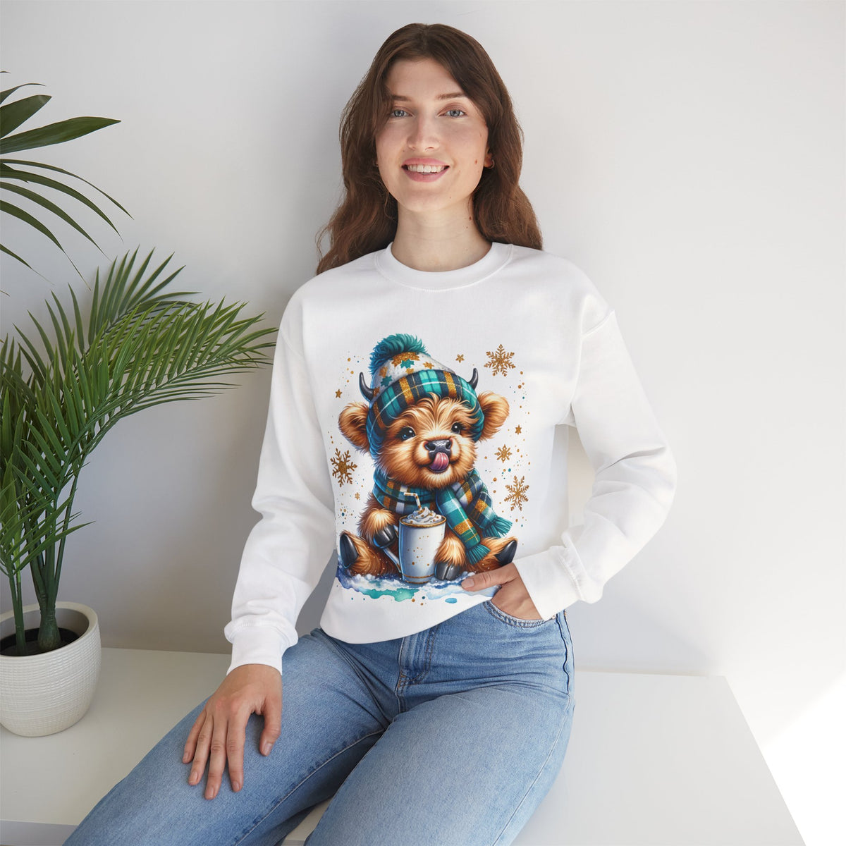 Winter Baby Highland Cow with Cocoa – Gildan Heavy Blend | Trendy Women’s Soft Sweatshirt. Direct to Garment. Printed & Shipped in the USA. Unisex Sizes.