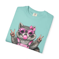 Cute But Feral, Raccoon in Pink Bibs - Comfort Colors | Trendy Women's T-Shirt. Direct to Garment. Printed & Shipped in the USA. Unisex Sizes.