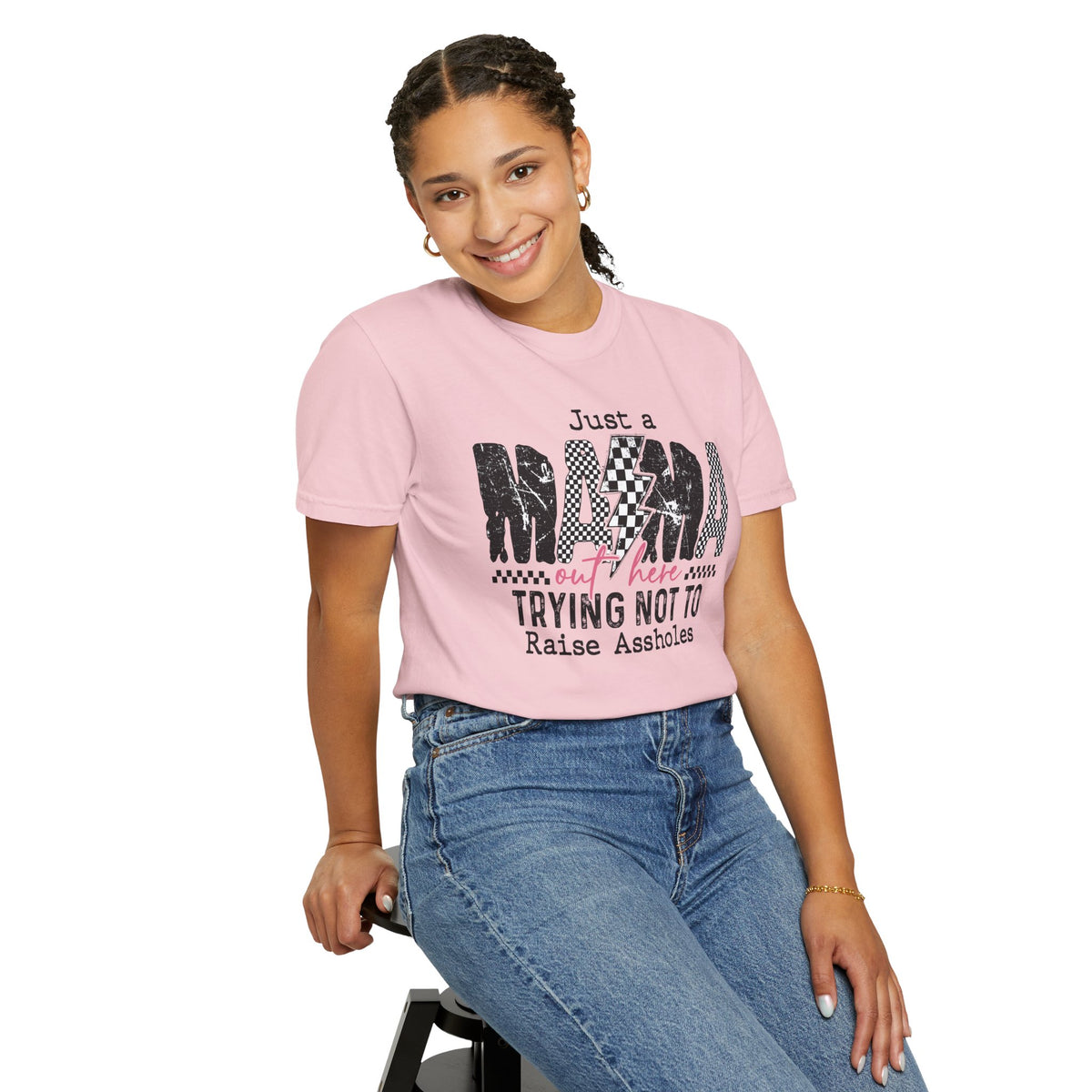 Just a Mama Out Here Trying Not To Raise Assholes - Comfort Colors | Trendy Women's T-Shirt. Direct to Garment. Printed & Shipped in the USA. Unisex Sizes.
