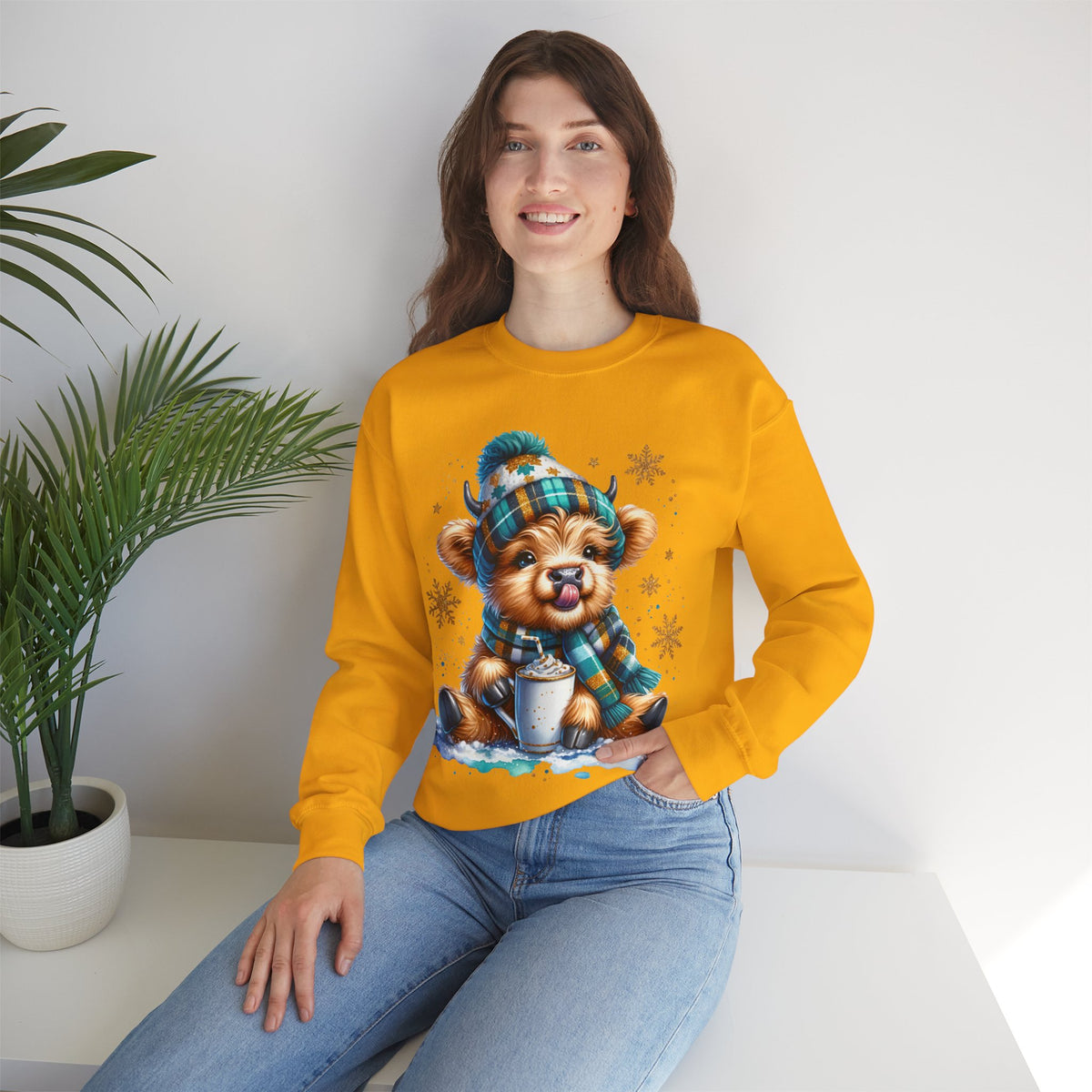 Winter Baby Highland Cow with Cocoa – Gildan Heavy Blend | Trendy Women’s Soft Sweatshirt. Direct to Garment. Printed & Shipped in the USA. Unisex Sizes.