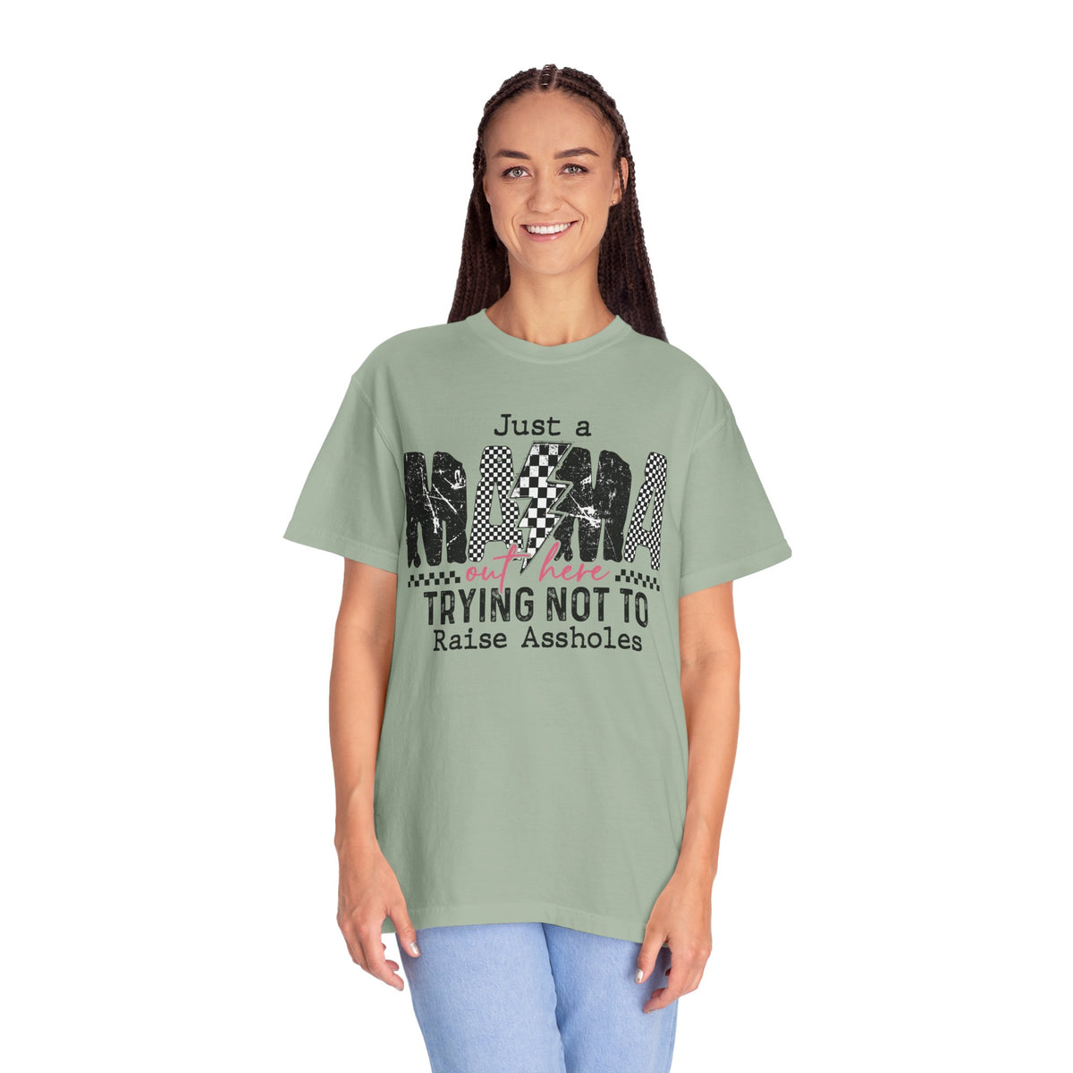 Just a Mama Out Here Trying Not To Raise Assholes - Comfort Colors | Trendy Women's T-Shirt. Direct to Garment. Printed & Shipped in the USA. Unisex Sizes.