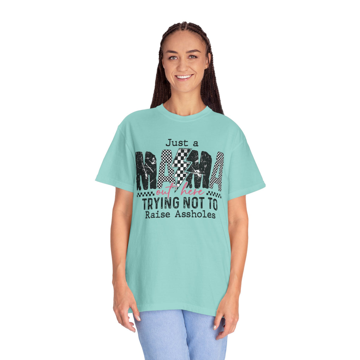 Just a Mama Out Here Trying Not To Raise Assholes - Comfort Colors | Trendy Women's T-Shirt. Direct to Garment. Printed & Shipped in the USA. Unisex Sizes.