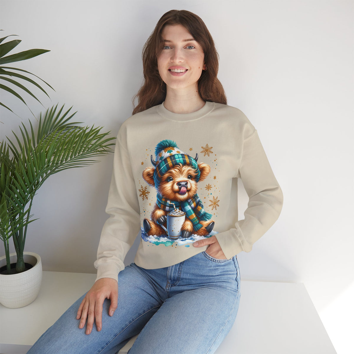 Winter Baby Highland Cow with Cocoa – Gildan Heavy Blend | Trendy Women’s Soft Sweatshirt. Direct to Garment. Printed & Shipped in the USA. Unisex Sizes.