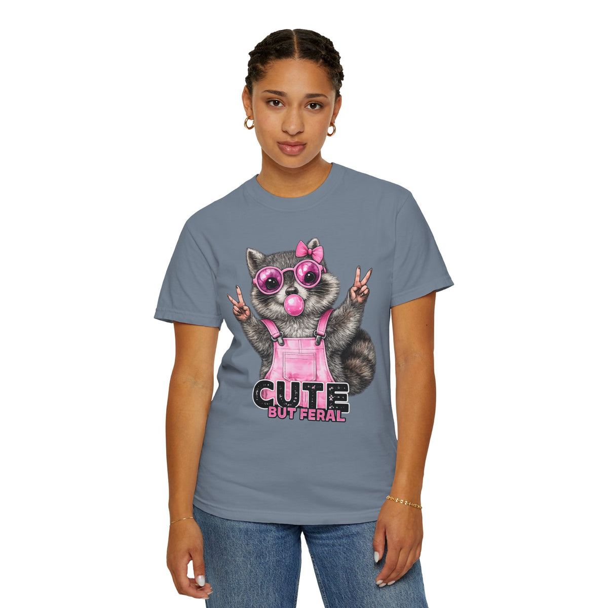 Cute But Feral, Raccoon in Pink Bibs - Comfort Colors | Trendy Women's T-Shirt. Direct to Garment. Printed & Shipped in the USA. Unisex Sizes.