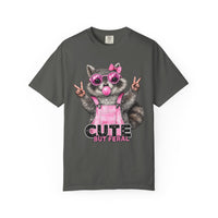 Cute But Feral, Raccoon in Pink Bibs - Comfort Colors | Trendy Women's T-Shirt. Direct to Garment. Printed & Shipped in the USA. Unisex Sizes.