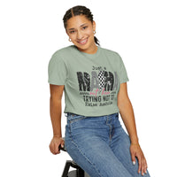 Just a Mama Out Here Trying Not To Raise Assholes - Comfort Colors | Trendy Women's T-Shirt. Direct to Garment. Printed & Shipped in the USA. Unisex Sizes.