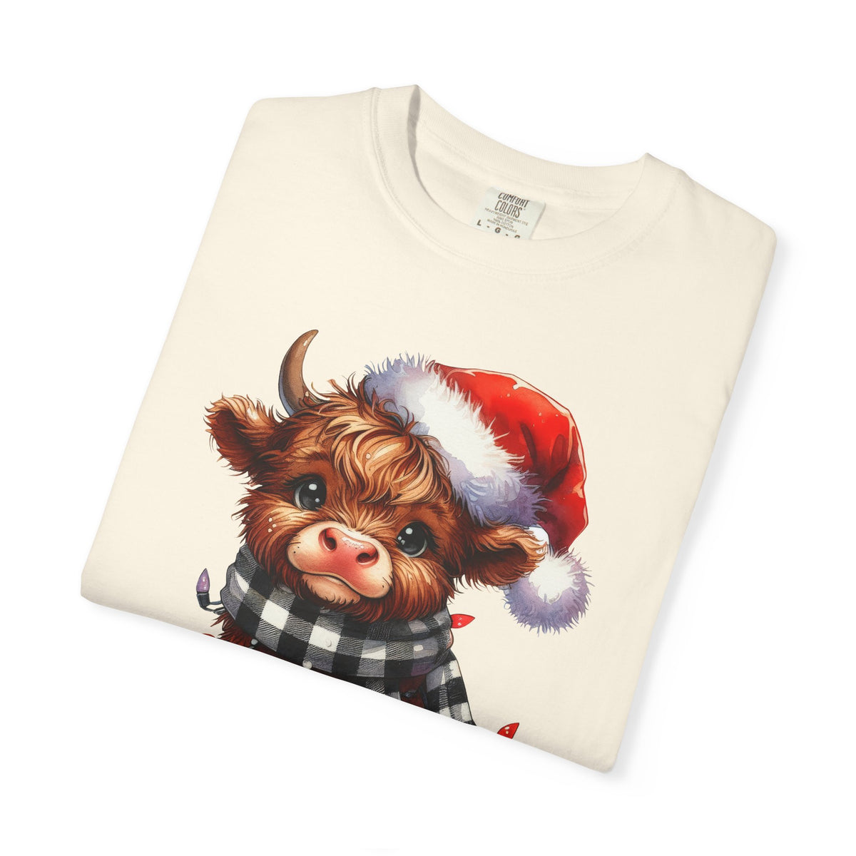 Cute Highland Cow Santa Hat Scarf Christmas Lights - Comfort Colors | Trendy Unisex T-Shirt. Direct to Garment. Printed & Shipped in the USA. Unisex Sizes.