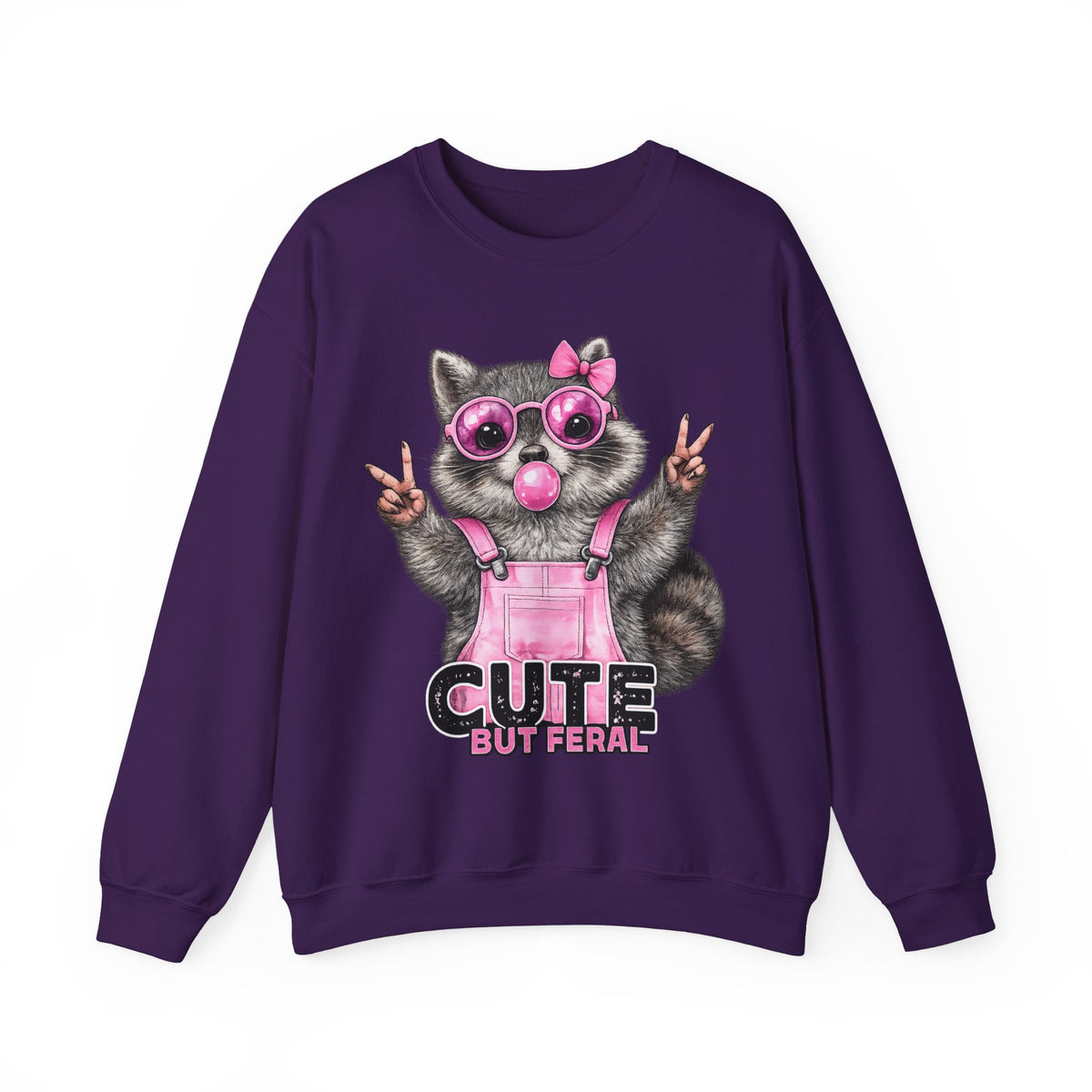 Cute But Feral, Raccoon in Pink Bibs – Gildan Heavy Blend | Trendy Women’s Soft Sweatshirt. Direct to Garment. Printed & Shipped in the USA. Unisex Sizes.