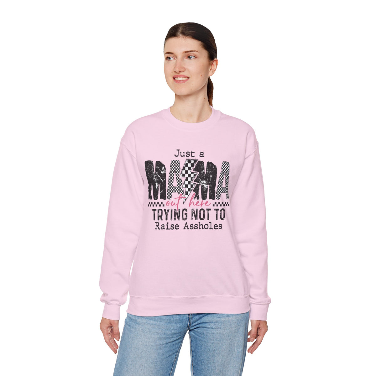 Just a Mama Out Here Trying Not To Raise Assholes – Gildan Heavy Blend | Trendy Women’s Soft Sweatshirt. Direct to Garment. Printed & Shipped in the USA. Unisex Sizes.