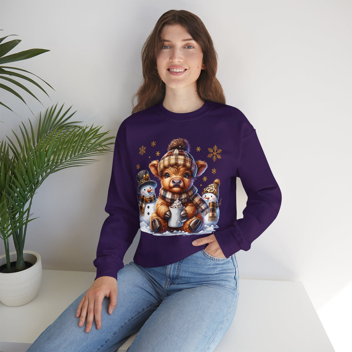 Cute Highland Cow with Snowmen, Winter – Gildan Heavy Blend | Trendy Women’s Soft Sweatshirt. Direct to Garment. Printed & Shipped in the USA. Unisex Sizes.