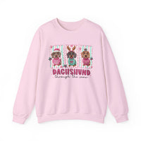 Dachshund Through the Snow – Gildan Heavy Blend | Trendy Women’s Soft Sweatshirt. Direct to Garment. Printed & Shipped in the USA. Unisex Sizes.