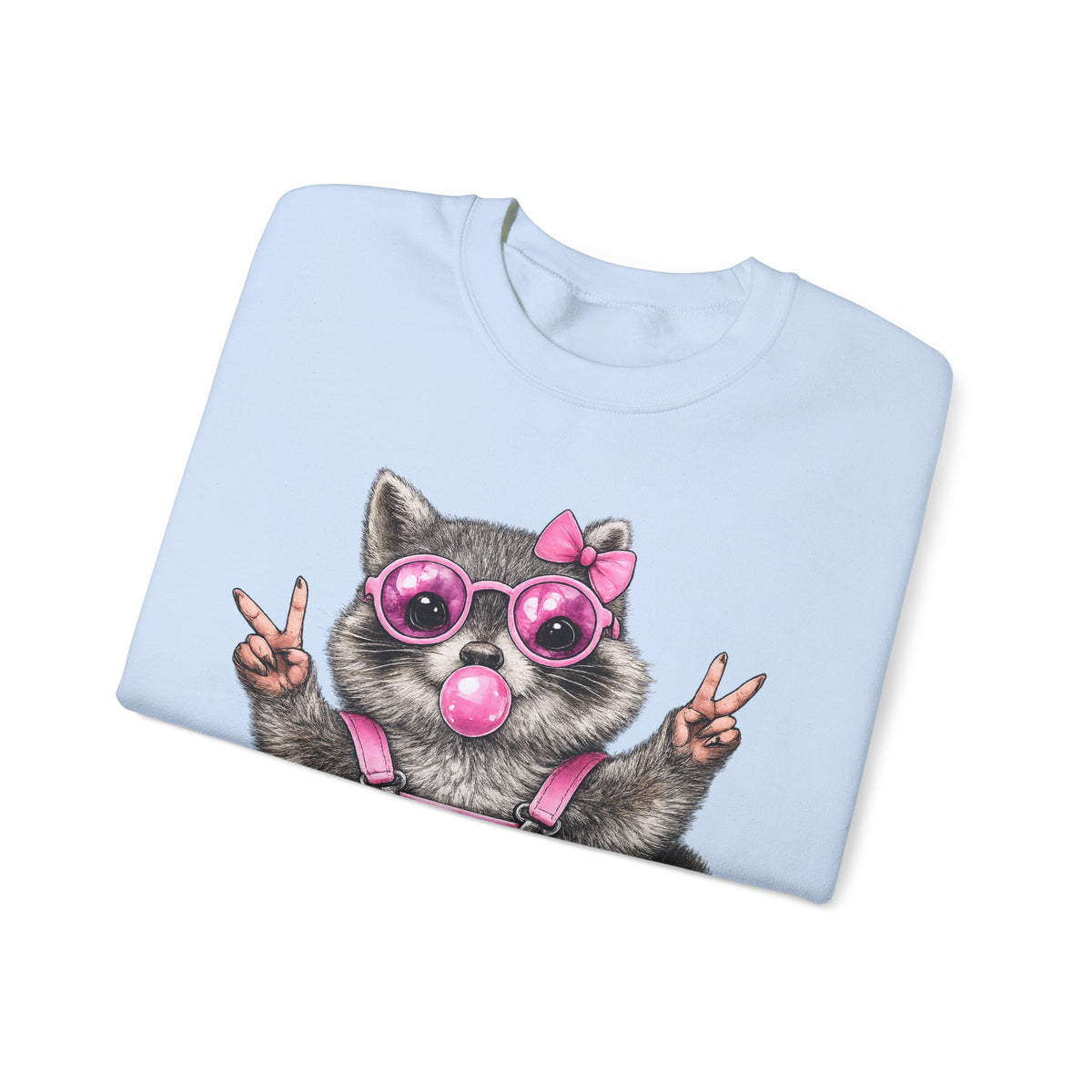 Cute But Feral, Raccoon in Pink Bibs – Gildan Heavy Blend | Trendy Women’s Soft Sweatshirt. Direct to Garment. Printed & Shipped in the USA. Unisex Sizes.