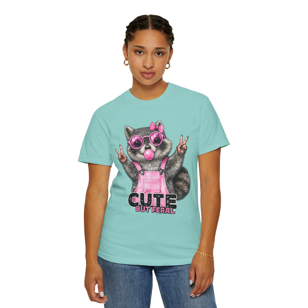 Cute But Feral, Raccoon in Pink Bibs - Comfort Colors | Trendy Women's T-Shirt. Direct to Garment. Printed & Shipped in the USA. Unisex Sizes.