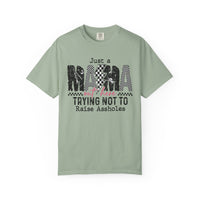 Just a Mama Out Here Trying Not To Raise Assholes - Comfort Colors | Trendy Women's T-Shirt. Direct to Garment. Printed & Shipped in the USA. Unisex Sizes.