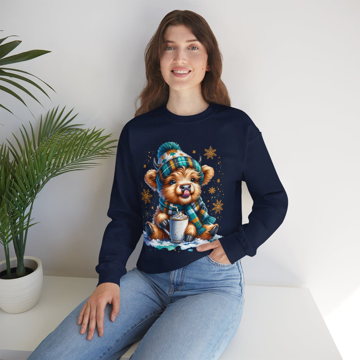 Winter Baby Highland Cow with Cocoa – Gildan Heavy Blend | Trendy Women’s Soft Sweatshirt. Direct to Garment. Printed & Shipped in the USA. Unisex Sizes.