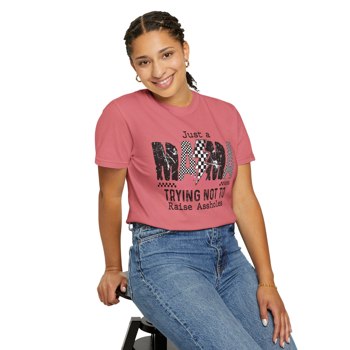 Just a Mama Out Here Trying Not To Raise Assholes - Comfort Colors | Trendy Women's T-Shirt. Direct to Garment. Printed & Shipped in the USA. Unisex Sizes.