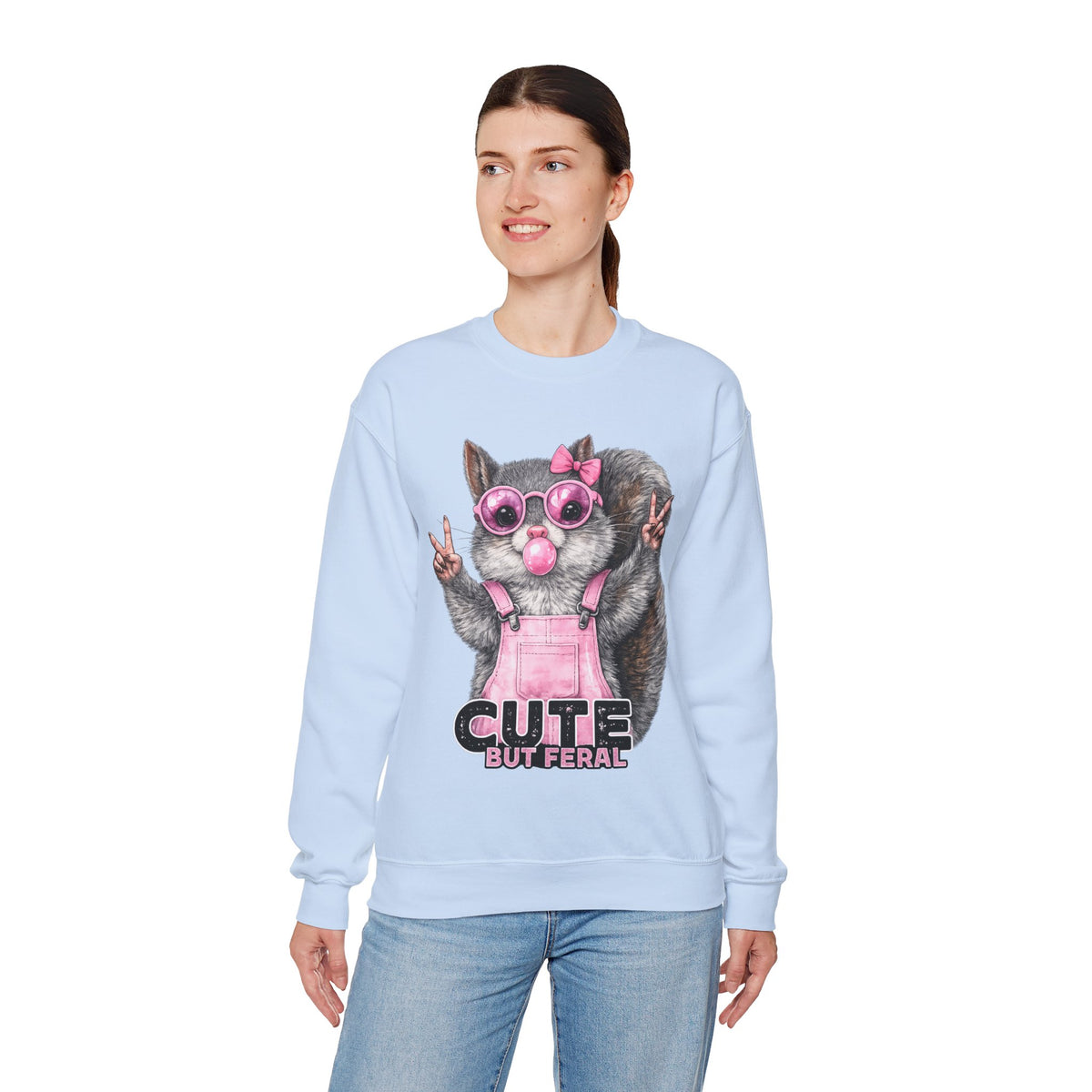 Cute But Feral, Squirrel in Pink Bibs – Gildan Heavy Blend | Trendy Women’s Soft Sweatshirt. Direct to Garment. Printed & Shipped in the USA. Unisex Sizes.