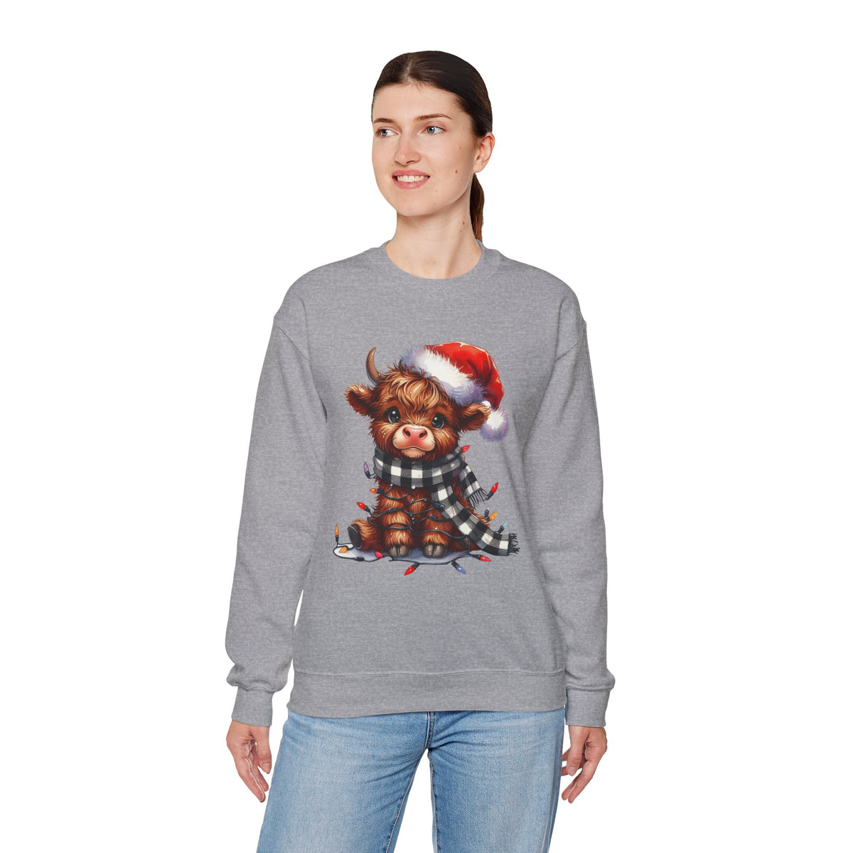 Cute Highland Cow Santa Hat Scarf Christmas Lights – Gildan Heavy Blend | Trendy Women’s Soft Sweatshirt. Direct to Garment. Printed & Shipped in the USA. Unisex Sizes.