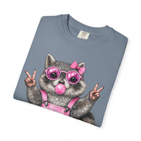 Cute But Feral, Raccoon in Pink Bibs - Comfort Colors | Trendy Women's T-Shirt. Direct to Garment. Printed & Shipped in the USA. Unisex Sizes.