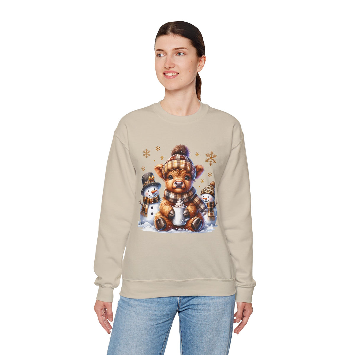 Cute Highland Cow with Snowmen, Winter – Gildan Heavy Blend | Trendy Women’s Soft Sweatshirt. Direct to Garment. Printed & Shipped in the USA. Unisex Sizes.