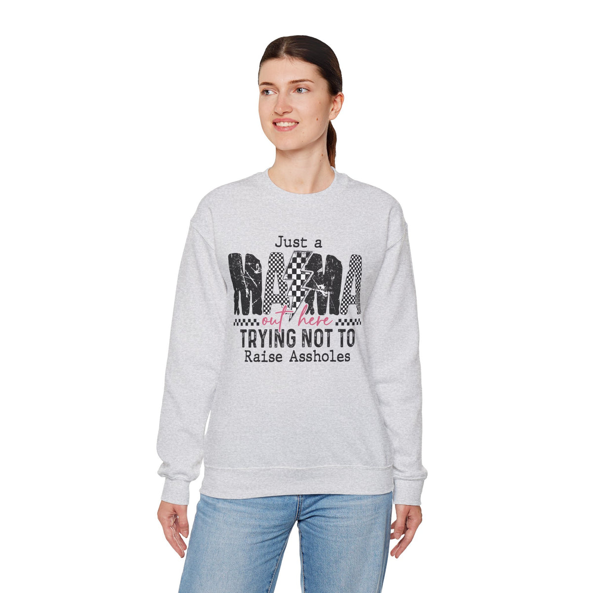 Just a Mama Out Here Trying Not To Raise Assholes – Gildan Heavy Blend | Trendy Women’s Soft Sweatshirt. Direct to Garment. Printed & Shipped in the USA. Unisex Sizes.