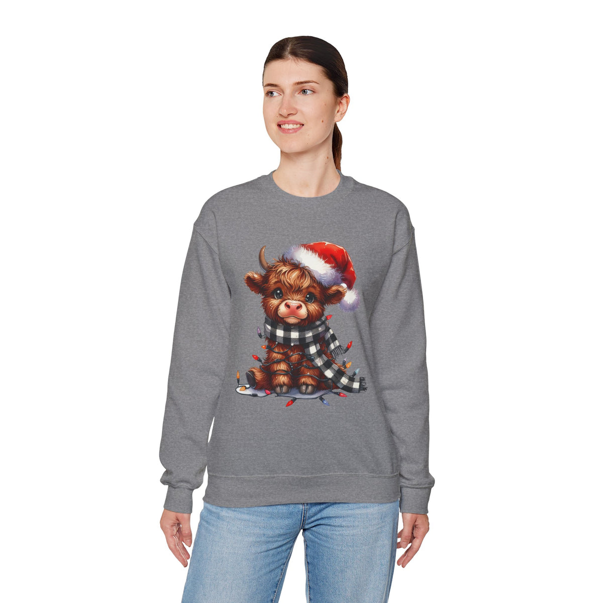 Cute Highland Cow Santa Hat Scarf Christmas Lights – Gildan Heavy Blend | Trendy Women’s Soft Sweatshirt. Direct to Garment. Printed & Shipped in the USA. Unisex Sizes.