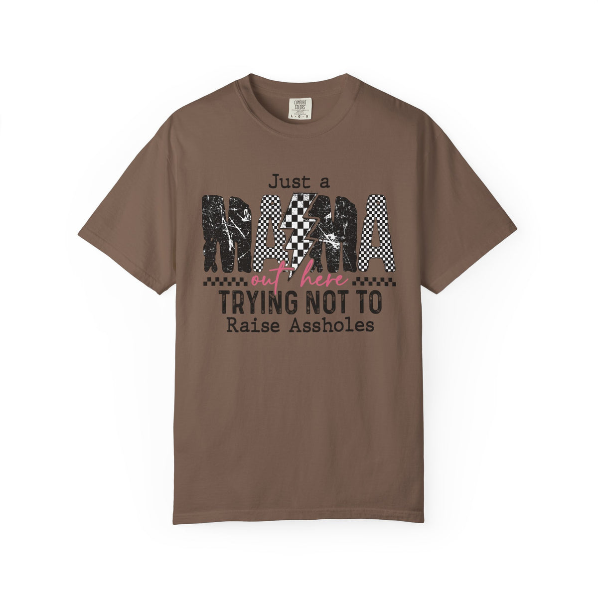 Just a Mama Out Here Trying Not To Raise Assholes - Comfort Colors | Trendy Women's T-Shirt. Direct to Garment. Printed & Shipped in the USA. Unisex Sizes.