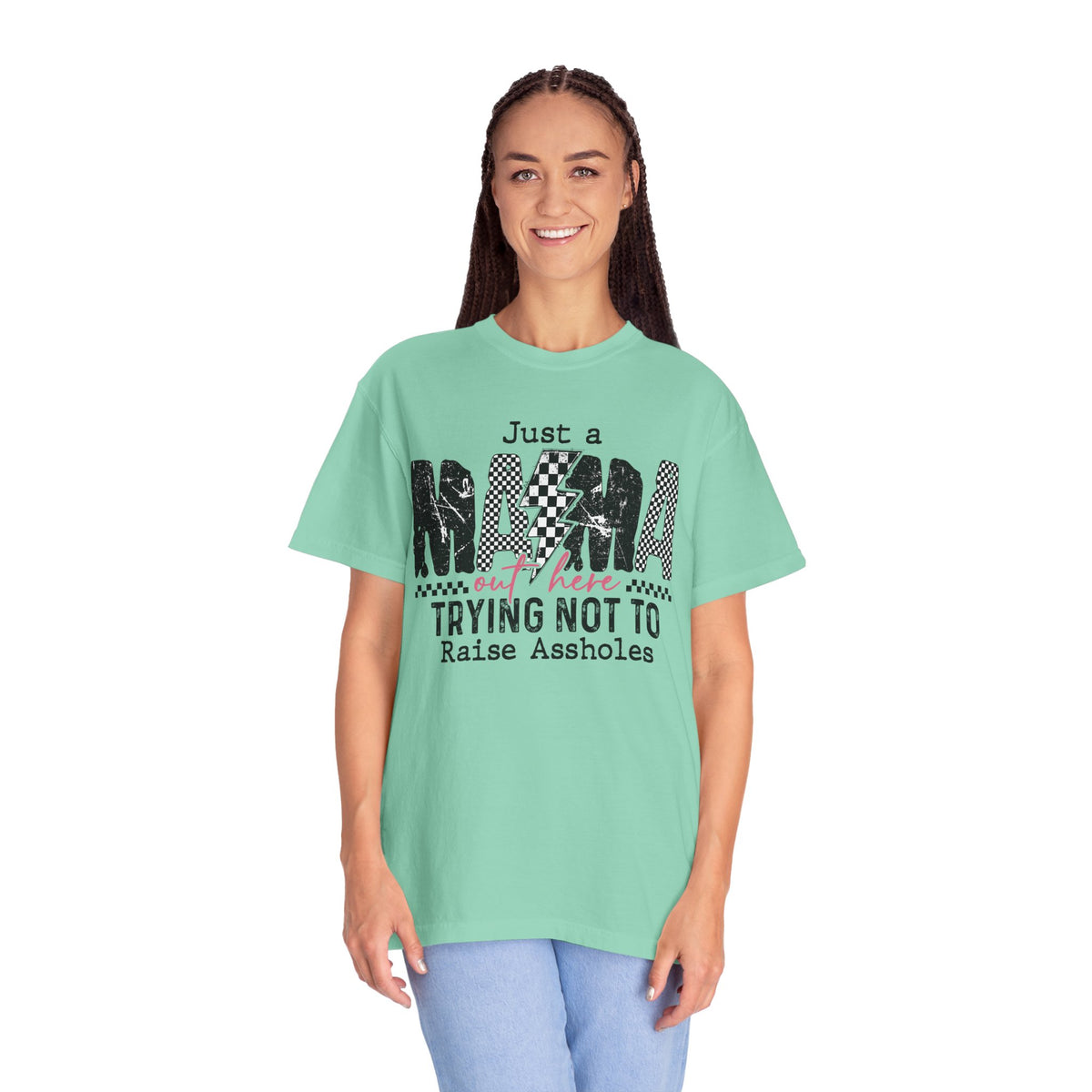 Just a Mama Out Here Trying Not To Raise Assholes - Comfort Colors | Trendy Women's T-Shirt. Direct to Garment. Printed & Shipped in the USA. Unisex Sizes.