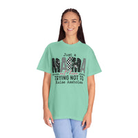 Just a Mama Out Here Trying Not To Raise Assholes - Comfort Colors | Trendy Women's T-Shirt. Direct to Garment. Printed & Shipped in the USA. Unisex Sizes.
