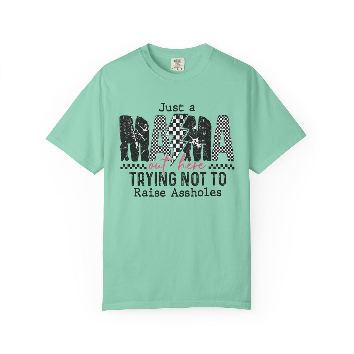 Just a Mama Out Here Trying Not To Raise Assholes - Comfort Colors | Trendy Women's T-Shirt. Direct to Garment. Printed & Shipped in the USA. Unisex Sizes.
