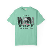 Just a Mama Out Here Trying Not To Raise Assholes - Comfort Colors | Trendy Women's T-Shirt. Direct to Garment. Printed & Shipped in the USA. Unisex Sizes.