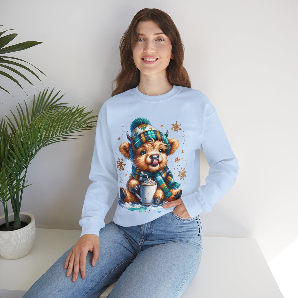 Winter Baby Highland Cow with Cocoa – Gildan Heavy Blend | Trendy Women’s Soft Sweatshirt. Direct to Garment. Printed & Shipped in the USA. Unisex Sizes.