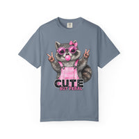 Cute But Feral, Raccoon in Pink Bibs - Comfort Colors | Trendy Women's T-Shirt. Direct to Garment. Printed & Shipped in the USA. Unisex Sizes.