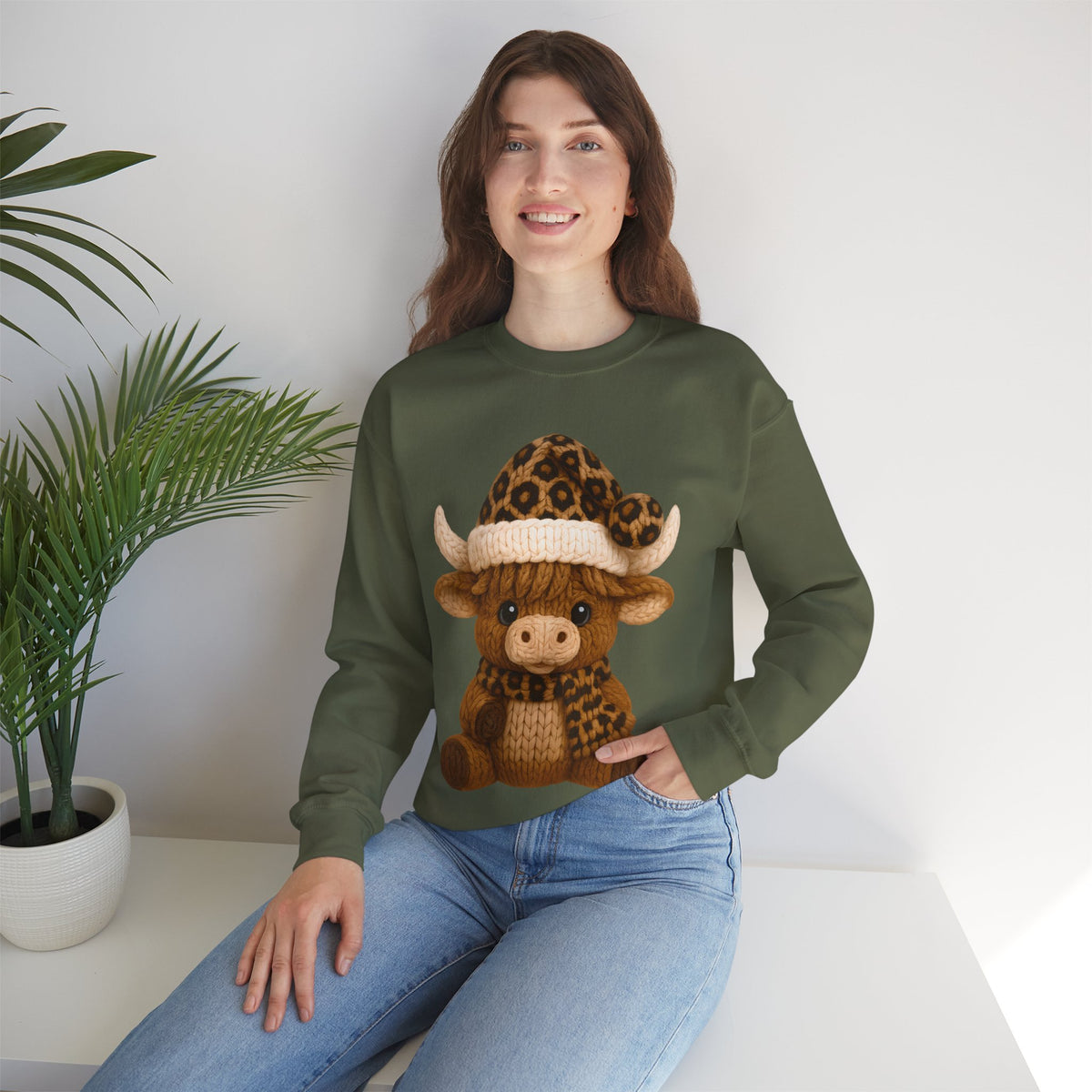 Cute Highland Cow with Leopard Santa Hat Christmas – Gildan Heavy Blend | Trendy Women’s Soft Sweatshirt. Direct to Garment. Printed & Shipped in the USA. Unisex Sizes.