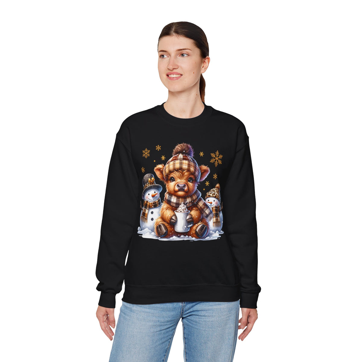 Cute Highland Cow with Snowmen, Winter – Gildan Heavy Blend | Trendy Women’s Soft Sweatshirt. Direct to Garment. Printed & Shipped in the USA. Unisex Sizes.