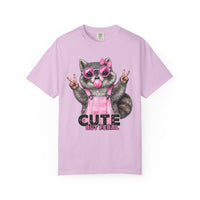 Cute But Feral, Raccoon in Pink Bibs - Comfort Colors | Trendy Women's T-Shirt. Direct to Garment. Printed & Shipped in the USA. Unisex Sizes.