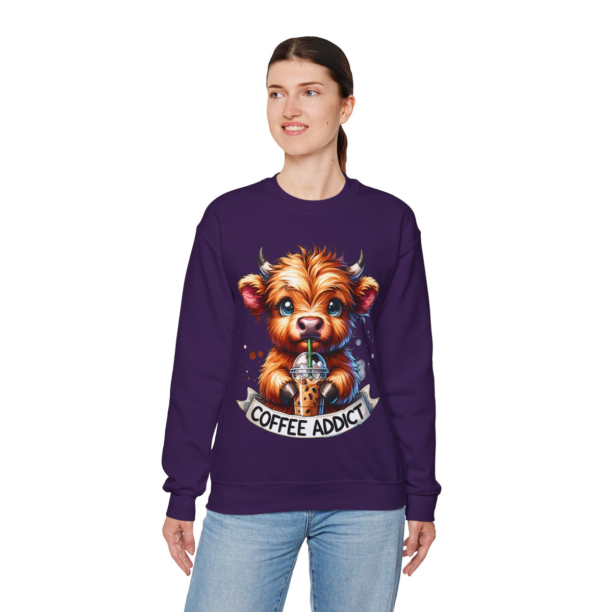Coffee Addict Highland Cow Drinking Iced Coffee – Gildan Heavy Blend | Trendy Women’s Soft Sweatshirt. Direct to Garment. Printed & Shipped in the USA. Unisex Sizes.