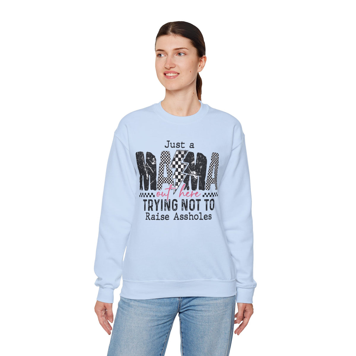 Just a Mama Out Here Trying Not To Raise Assholes – Gildan Heavy Blend | Trendy Women’s Soft Sweatshirt. Direct to Garment. Printed & Shipped in the USA. Unisex Sizes.