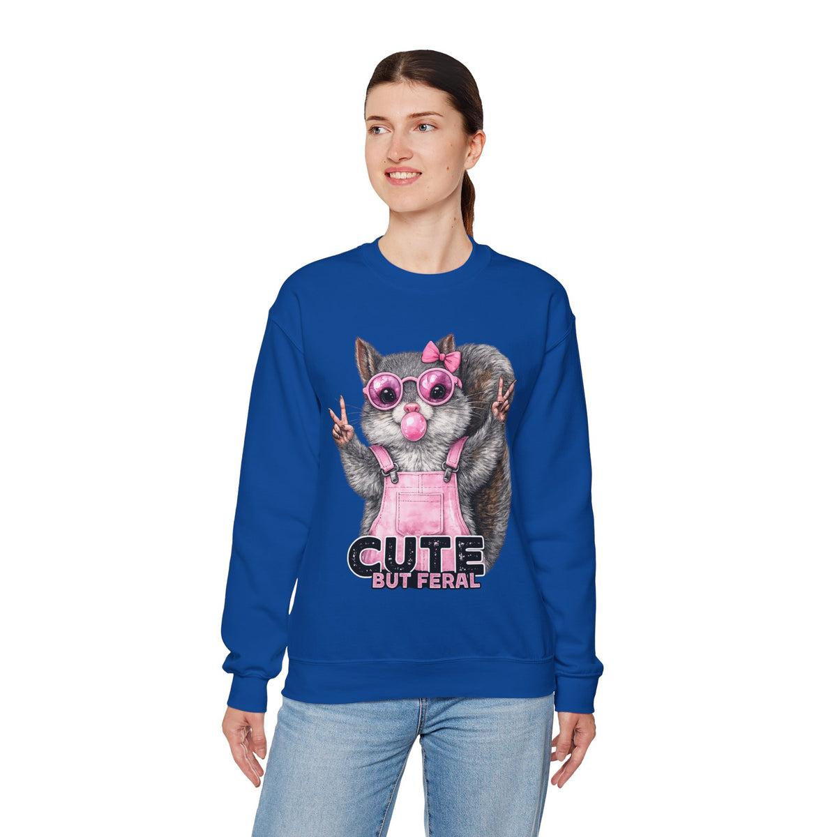 Cute But Feral, Squirrel in Pink Bibs – Gildan Heavy Blend | Trendy Women’s Soft Sweatshirt. Direct to Garment. Printed & Shipped in the USA. Unisex Sizes.