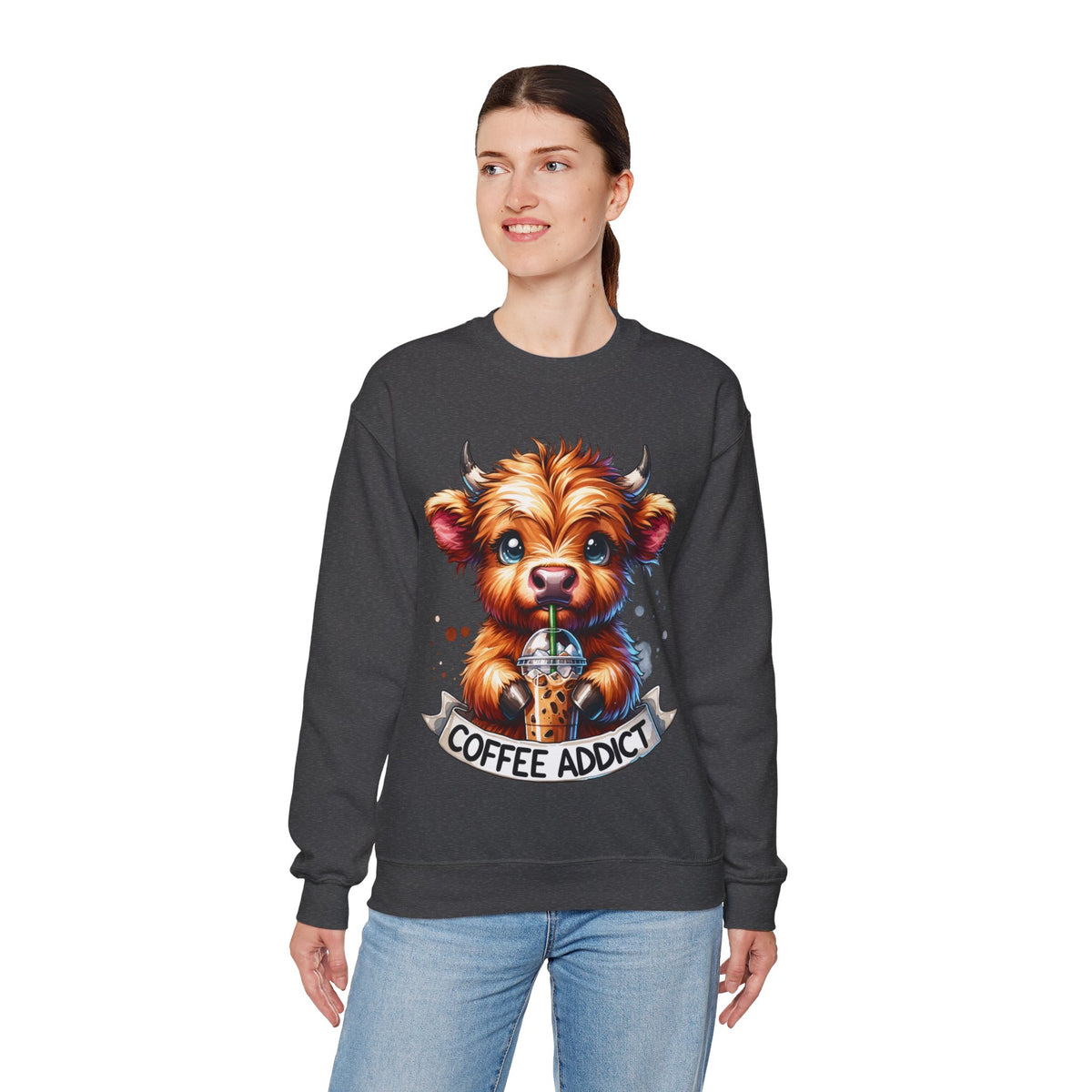 Coffee Addict Highland Cow Drinking Iced Coffee – Gildan Heavy Blend | Trendy Women’s Soft Sweatshirt. Direct to Garment. Printed & Shipped in the USA. Unisex Sizes.
