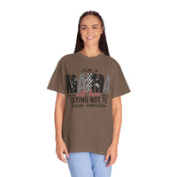 Just a Mama Out Here Trying Not To Raise Assholes - Comfort Colors | Trendy Women's T-Shirt. Direct to Garment. Printed & Shipped in the USA. Unisex Sizes.