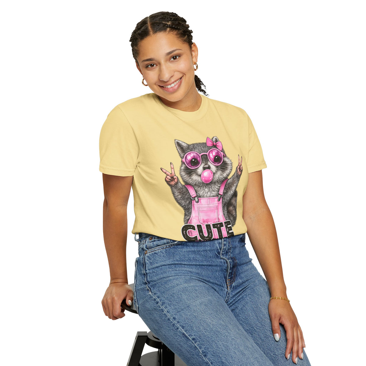 Cute But Feral, Raccoon in Pink Bibs - Comfort Colors | Trendy Women's T-Shirt. Direct to Garment. Printed & Shipped in the USA. Unisex Sizes.